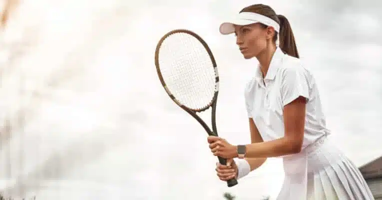 Woman Playing Tennis And Waiting For The Service